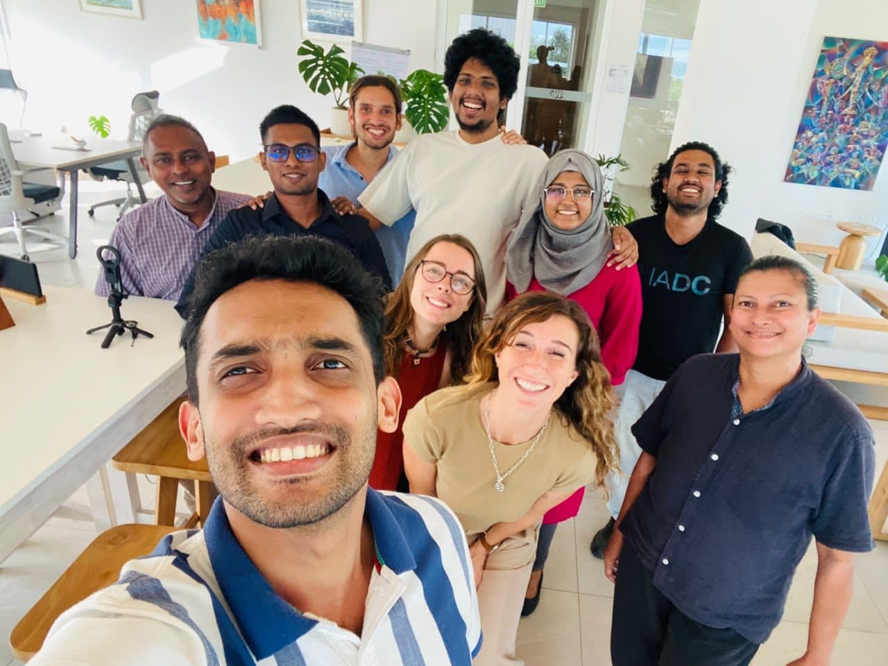 ASCEND participants taking a group selfie in a coworking space